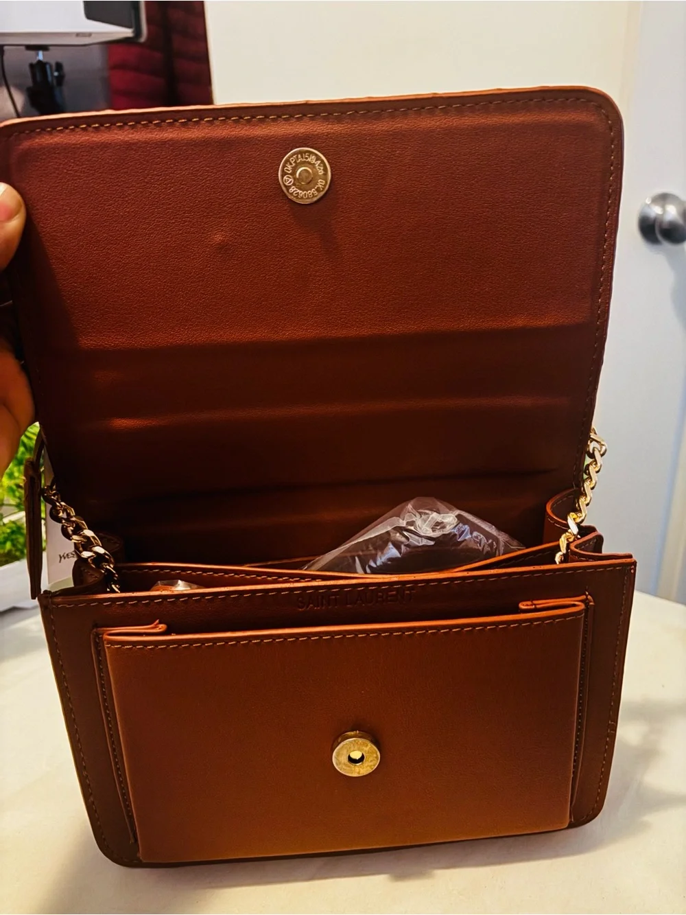 Sleek Brown crossbody bag with gold